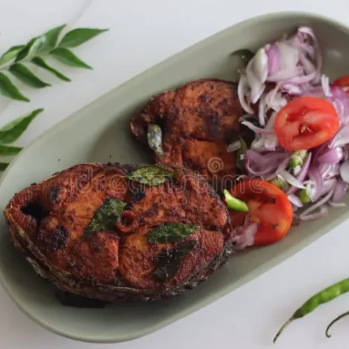 crispy-surmai-fish-fry-shallow-fried-king-kerala-style-served-onion-tomato-salad-called-challas-shot-white-background-256164435